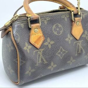 Louis Vuitton mini speedy with strap.